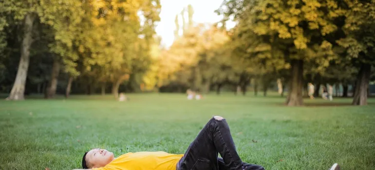 person laying on the grass