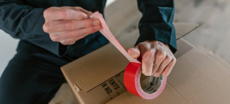 mover taping a box shut