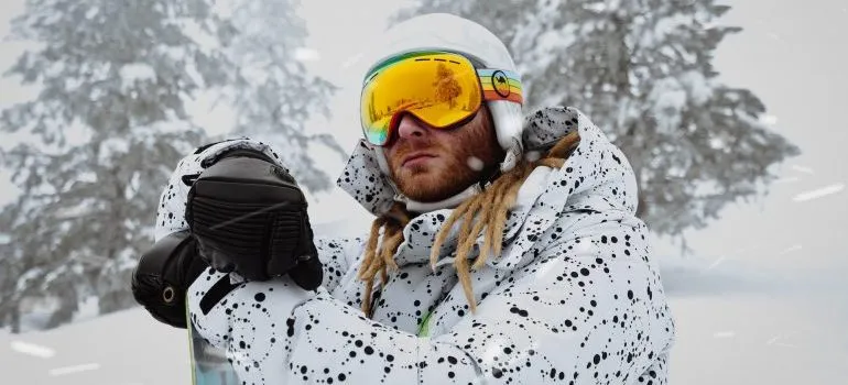 A man in ski clothes in the snow