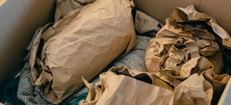 A box with items during the process of packing for storage