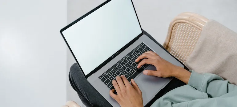 person on lap top looking for the best home storage services
