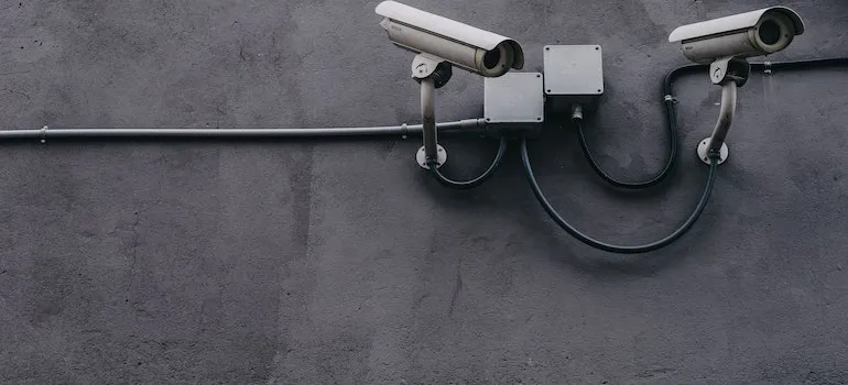 security cameras on a gray wall