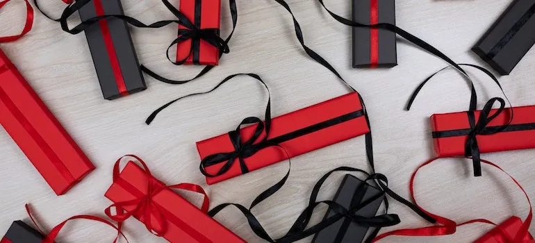 Red and black holiday presents on a table