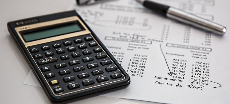 commercial moving budget papers with a calculator