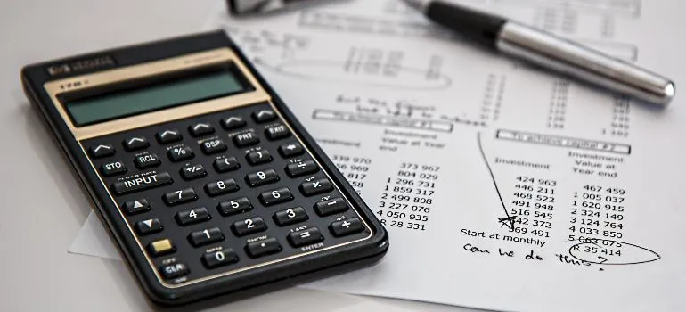 commercial moving budget papers with a calculator