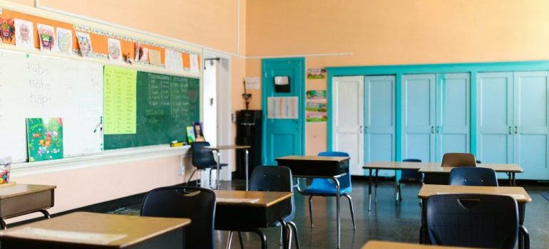 Classroom with wooden chairs and desks