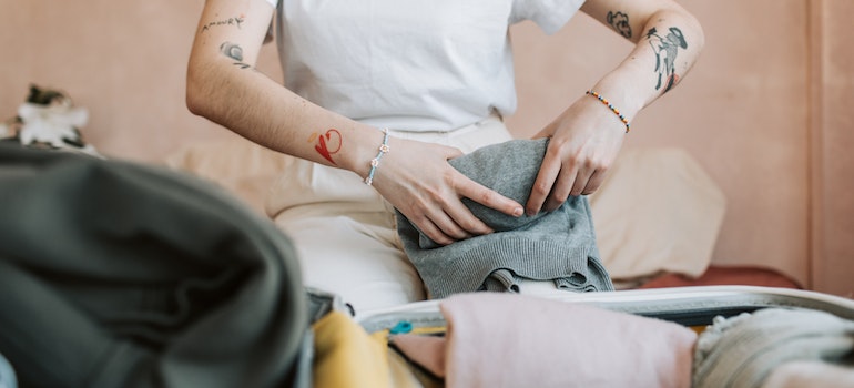 Woman packing her clothers