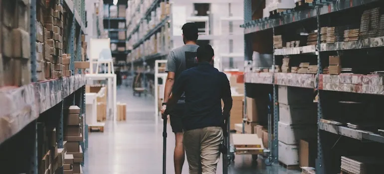 two man working in a storage room