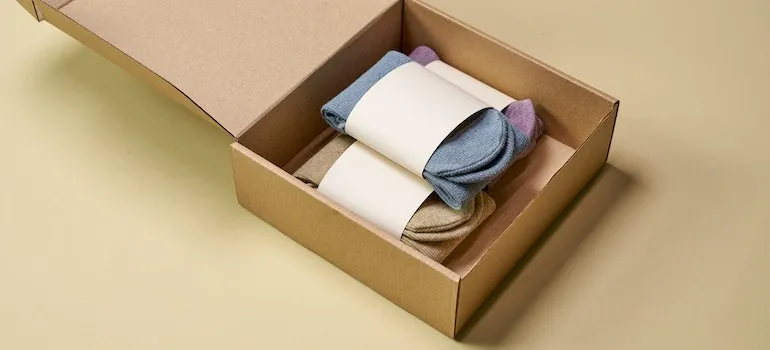 A cardboard packaging box with socks you need to start an online clothing store in Nampa
