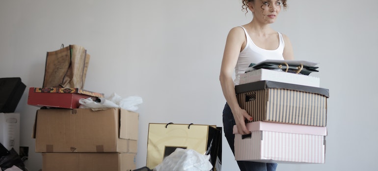 woman decluttering home and taking items to Boise self storage