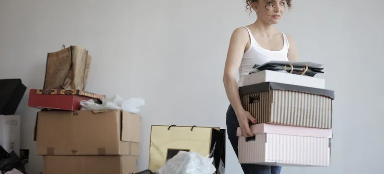 woman decluttering home and taking items to Boise self storage