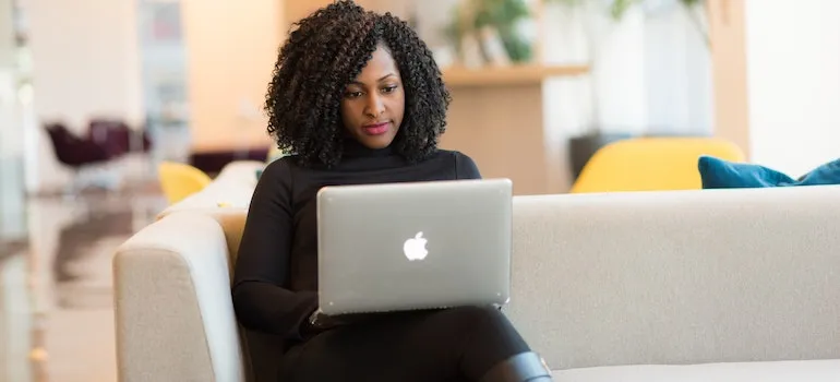 a woman monitoring the shipment of medical equipment on her laptop