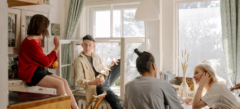 a group of friends talking in a co-living space