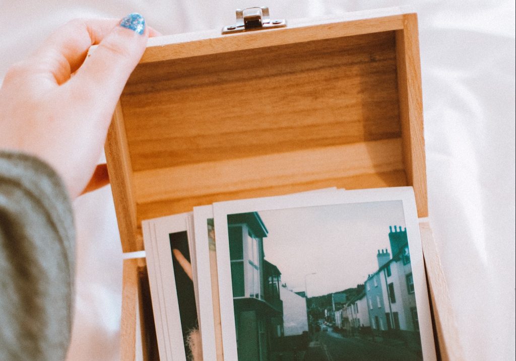 A close-up photo of pictures in a wooden box