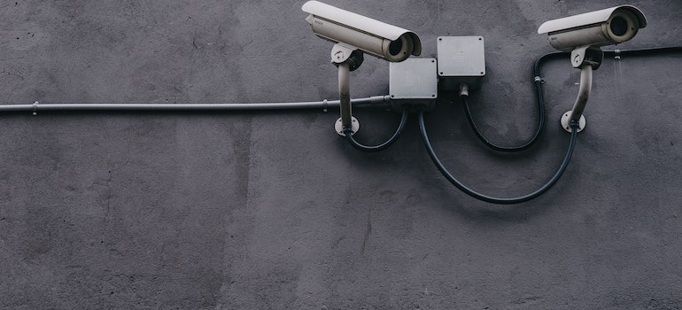 security cameras on a gray wall