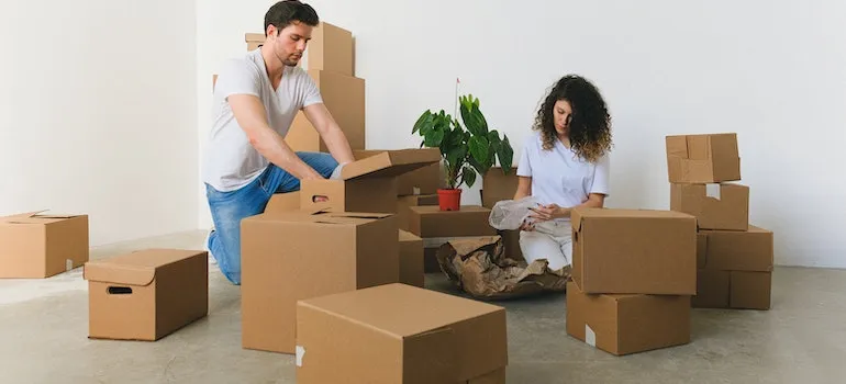 A couple is packing to prepare for moving to Boise