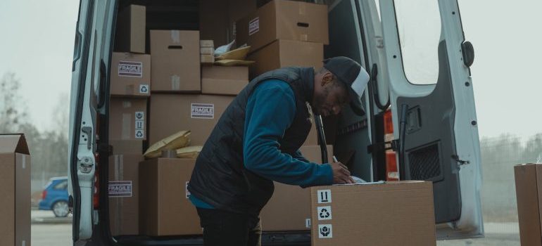 a professional mover writing something down