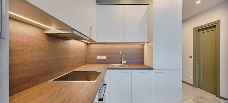 a minimalistic kitchen with warm colors representing popular home design practices