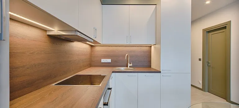 a minimalistic kitchen with warm colors representing popular home design practices