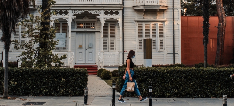 A woman walking down the street toward one of the landmarks in Nampa ID