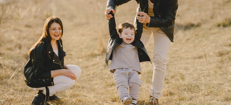 A family playing with their kid outside sharing facts about Boise suburbs