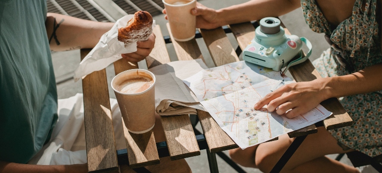 people having breakfast and reading a map with landmarks in Nampa ID