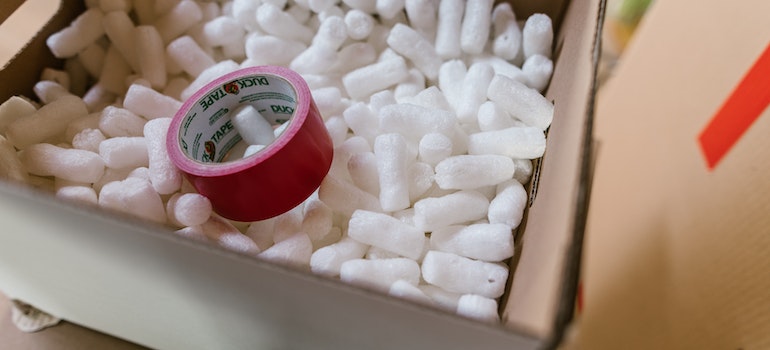 packing peanuts and duck tape in a box needed for packing and shipping for Idaho industries
