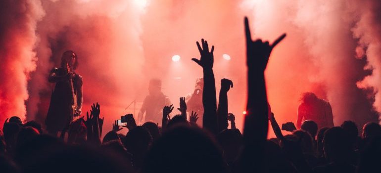 Hands in the air at a concert enjoy Caldwell's best live music venues and festivals