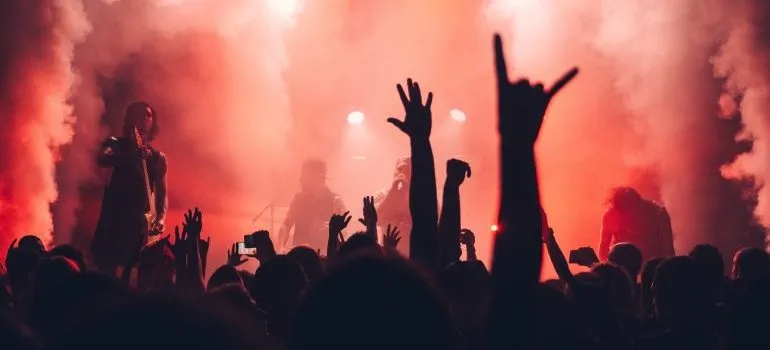 Hands in the air at a concert enjoy Caldwell's best live music venues and festivals