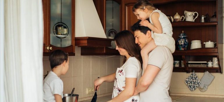 Parents and kids in the kitchen making food
