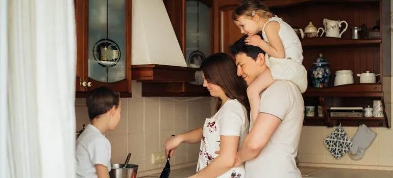 Parents and kids in the kitchen making food