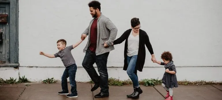 Parents with two kids, one of the families moving to Nampa