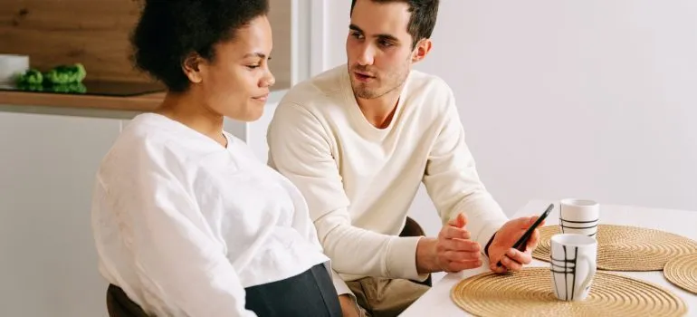 A couple having coffee and talking about how to move your home in Boise while pregnant