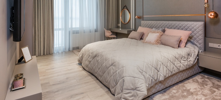 bedroom in neutral colors with big double bed