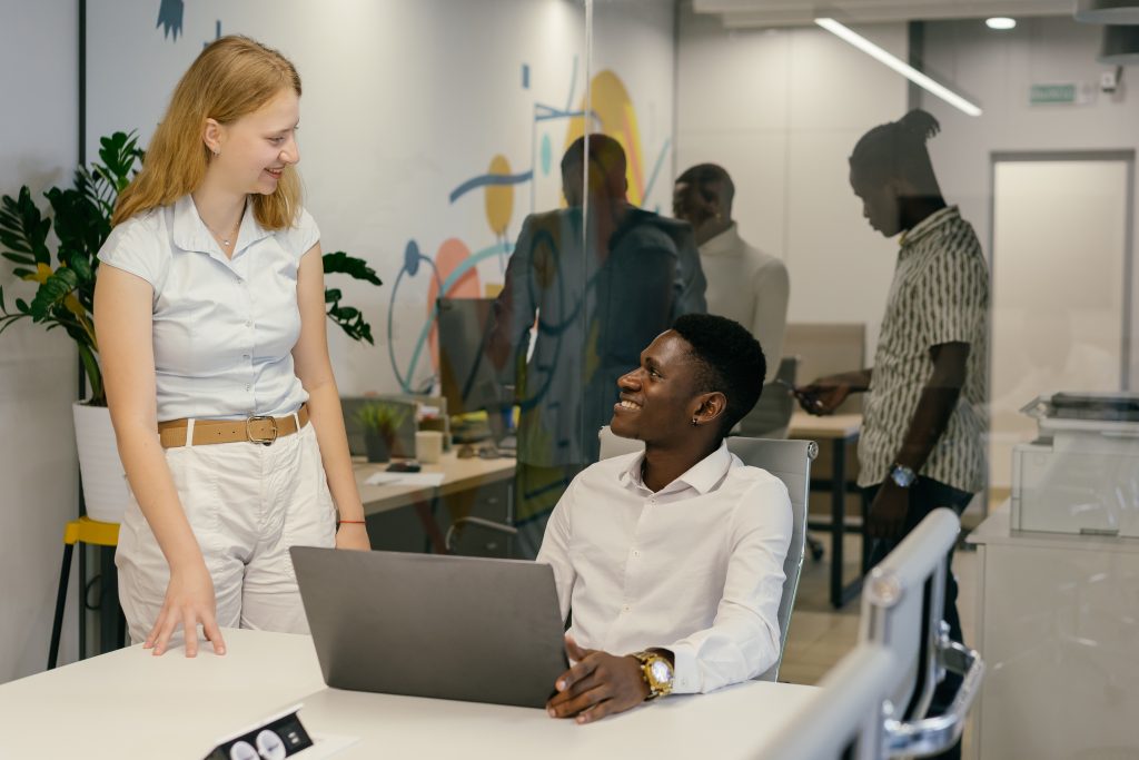 Coworkers talking in the office