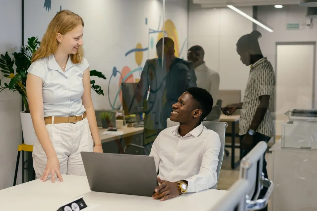 Coworkers talking in the office