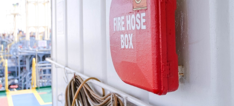 red fire hose box on the wall