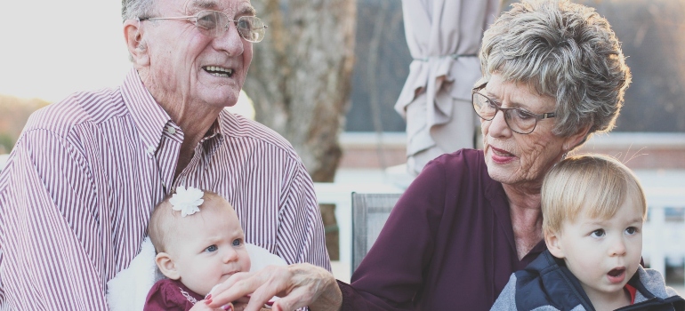 Elderly couple with grandkids after retiring in Boise