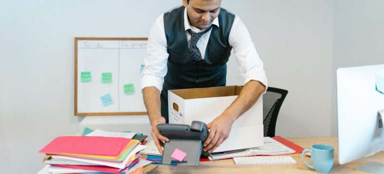 Man packing and planning to use mobile storage for commercial purposes