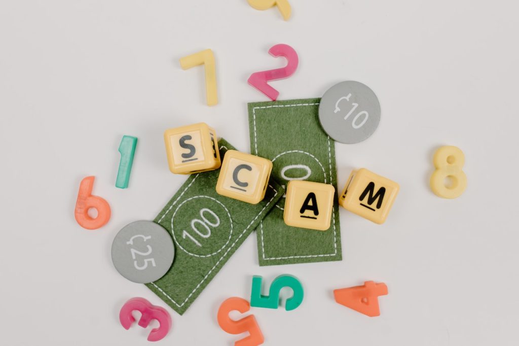 Scrabble letters spelling scam
