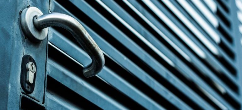 Blue door with a handle and lock