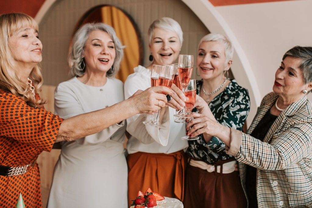 Seniors with raised glasses