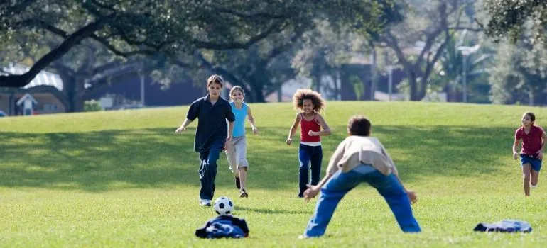 Kids playing on the grass field