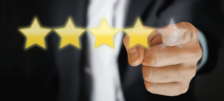A man touching five stars evaluating and choosing a commercial storage facility