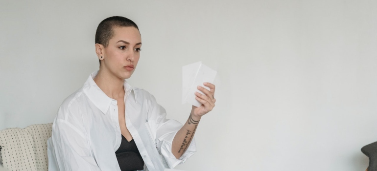 a girl holding a paper