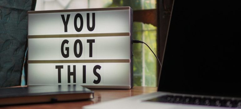 Message next to a laptop saying 