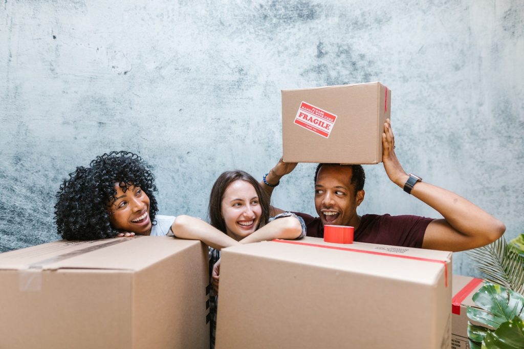 People holding moving boxes