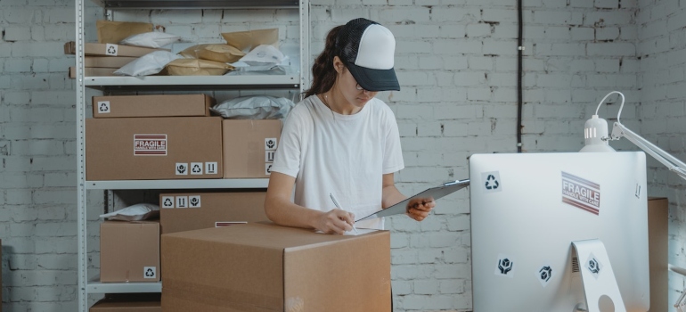 A woman reading how to create a comprehensive moving budget