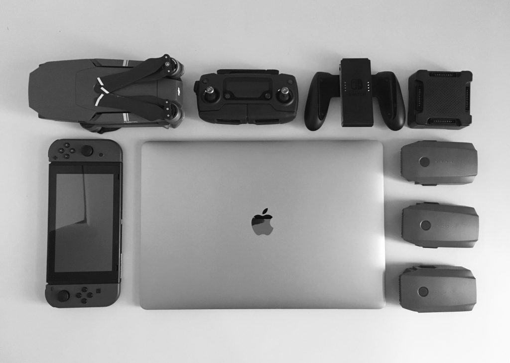 Gray and black electronics laid on the surface