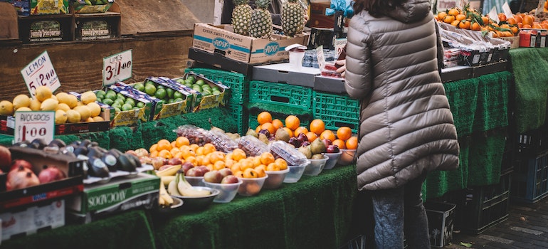 Woman buying fruits.